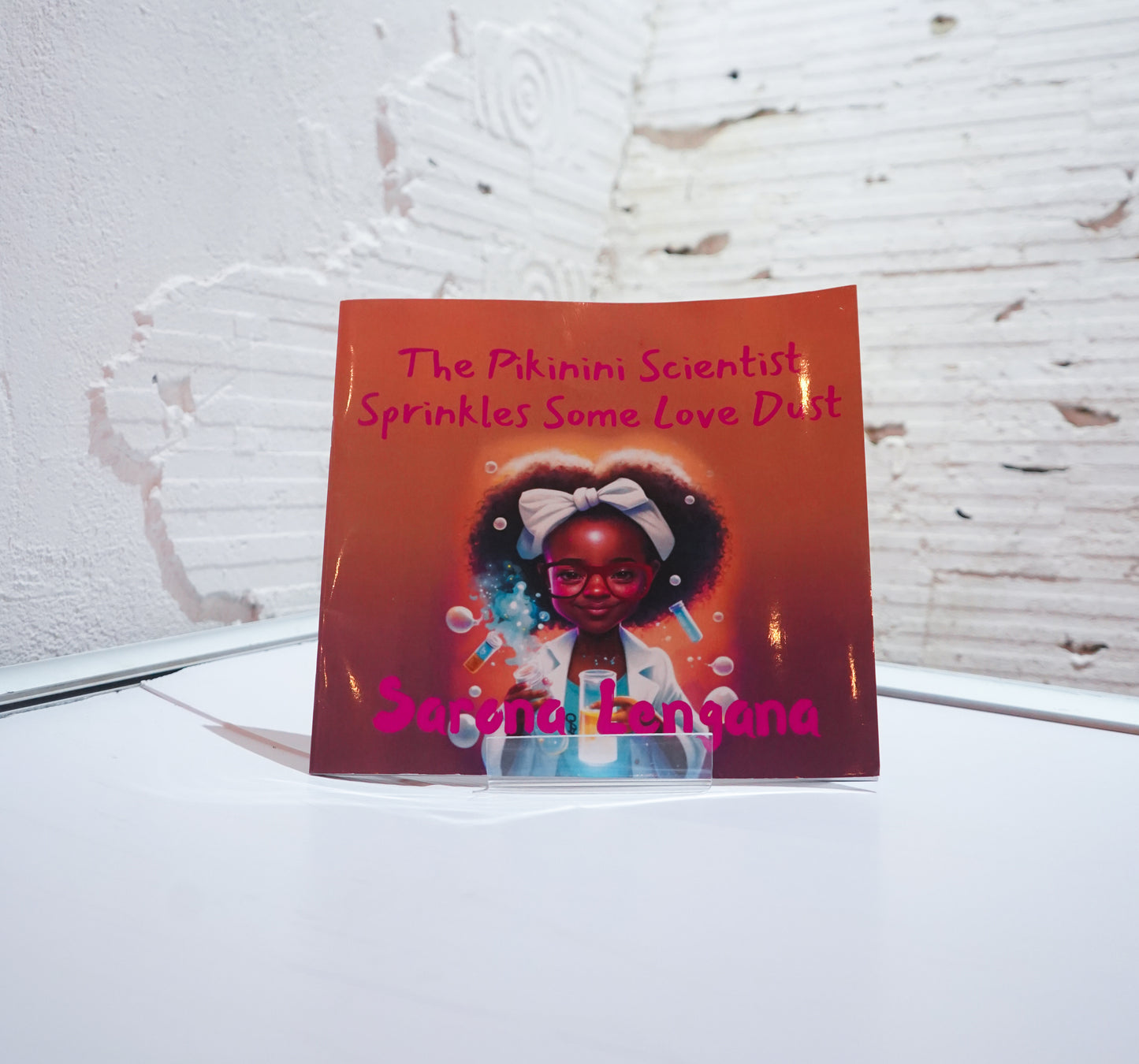 The Pikinini Scientist Sprinkles Some Love Dust, by Sarona Lengana