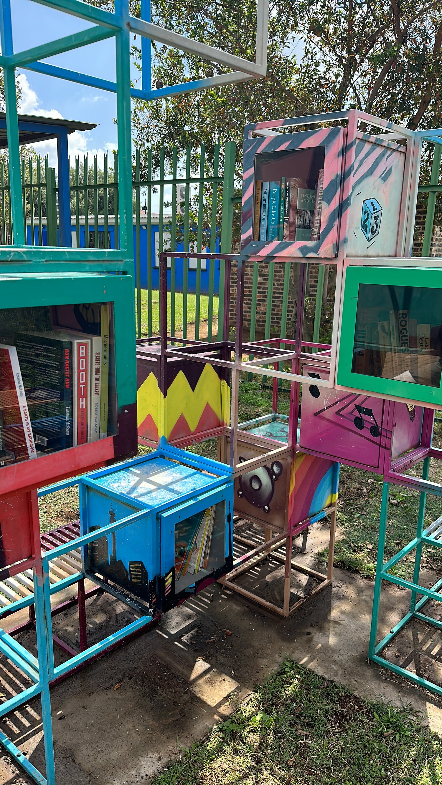 Colourful cubes that hold books at outdoor street library in Soweto